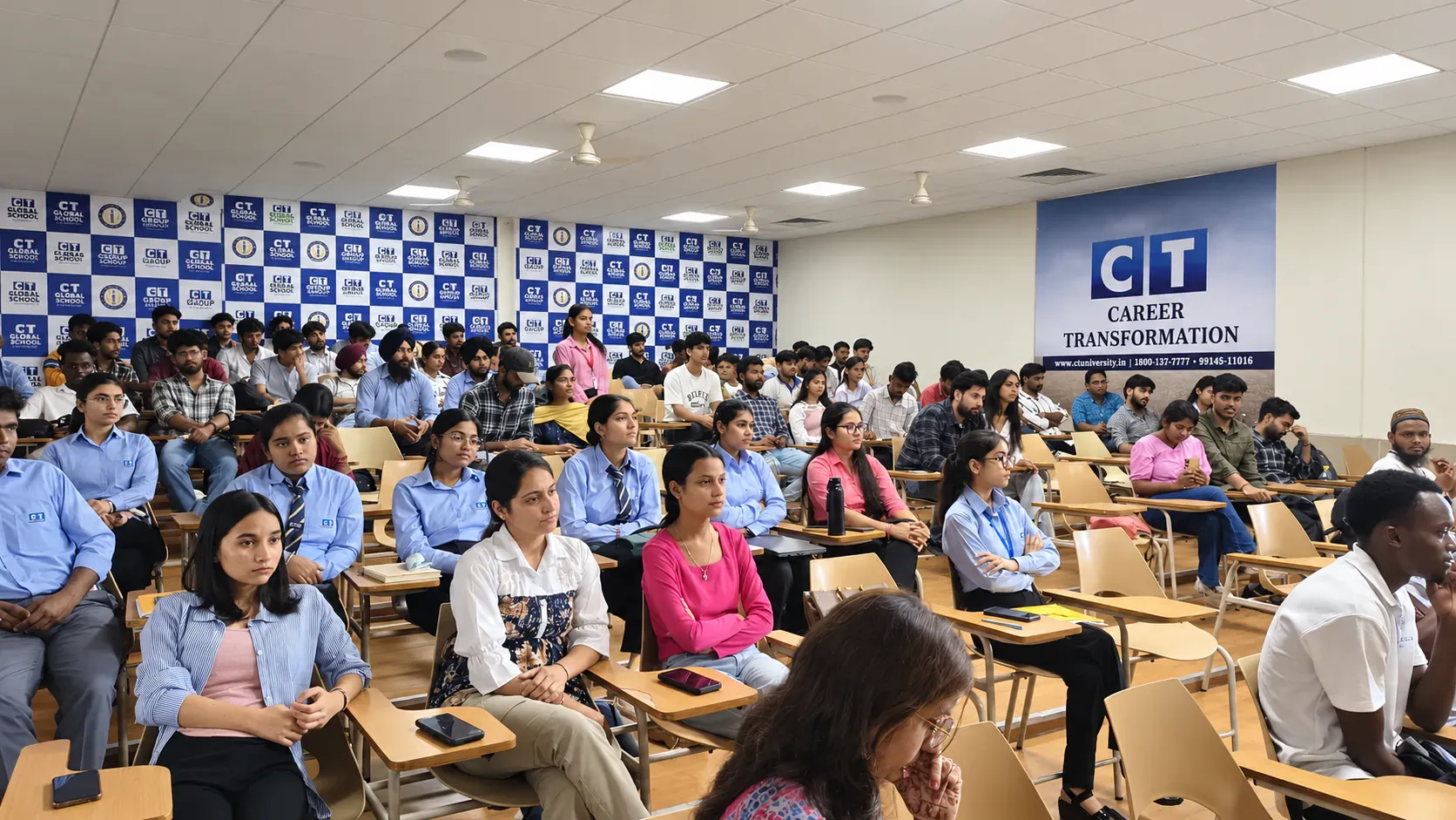 Students filling a university auditorium for a Mentorle session